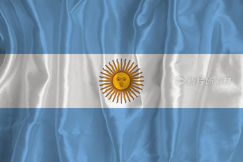 以丝绸为背景的阿根廷国旗是一个伟大的国家象征。国家的官方国家象征。阿根廷国旗背景