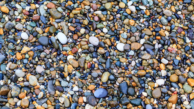 海石头背景。石头在沙滩上。石头纹理。