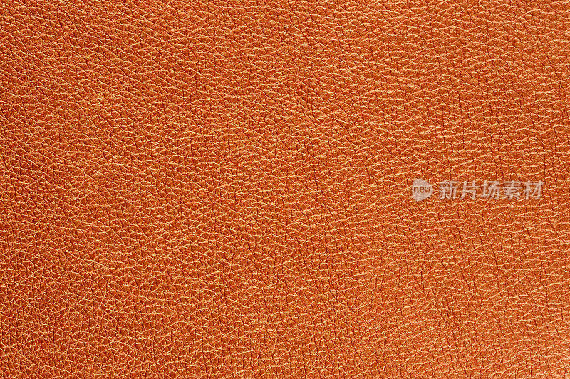 橙色光泽的人造皮革背景纹理