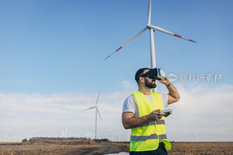 一个人用VR眼镜控制风车