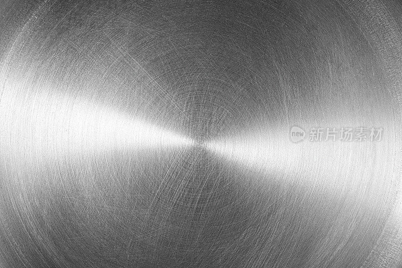 不锈钢或铝圆形拉丝光泽金属纹理。抽象的金属背景。圆的形状。