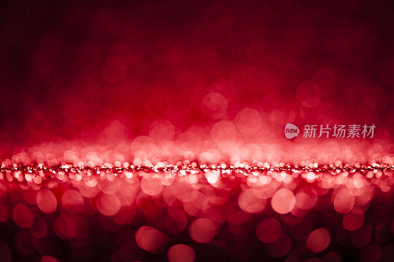 闪亮的灯散景-红色圣诞背景散焦抽象庆典