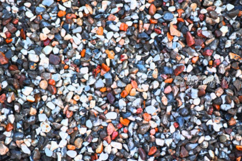 石材图案抽象拉ravel纹理小石头，小石头，鹅卵石在许多深浅的灰色，白色，棕色，粉红色的特写颜色为花岗岩纹理背景