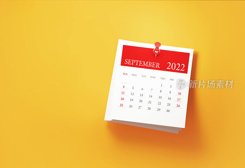 将2022年9月日历贴在黄色背景上