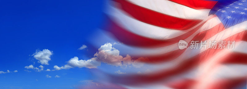 美国国旗在晴朗的蓝天上模糊运动