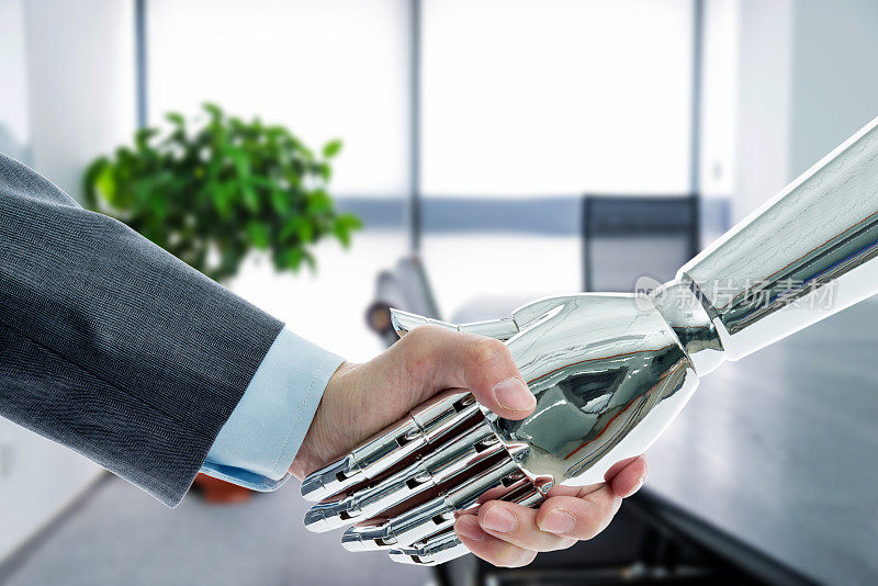 商人和机器人在会议室握手