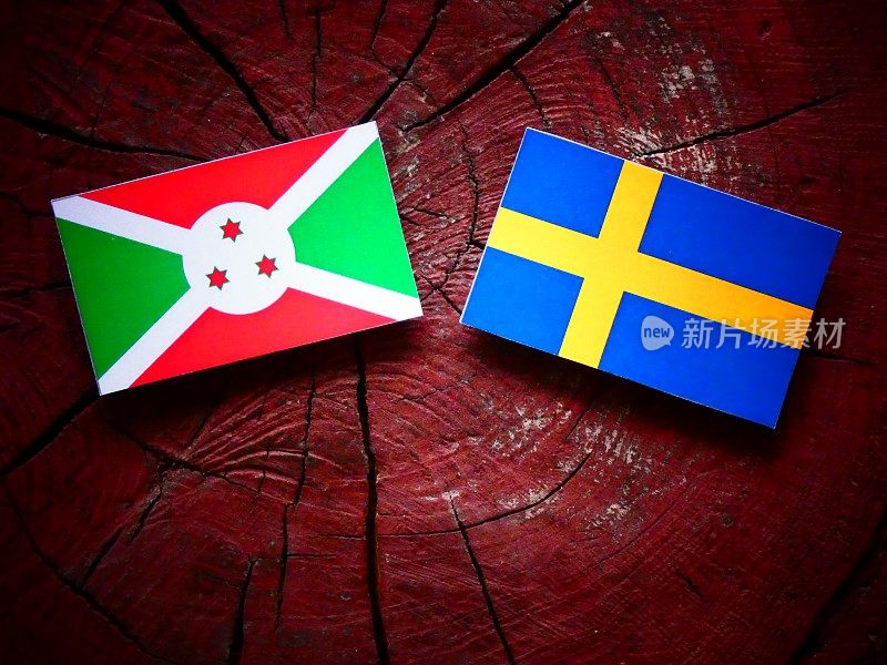 布隆迪国旗和瑞典国旗在一个树桩孤立