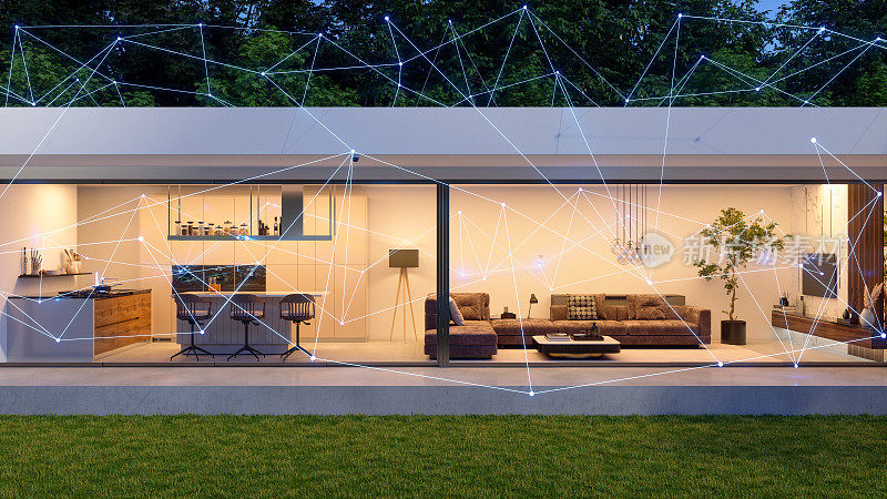 现代别墅外观与丛。智能家居的概念。控制与移动应用程序和技术设备。