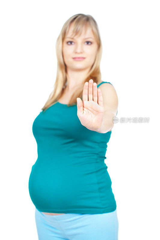 年轻孕妇用手掌示意停止