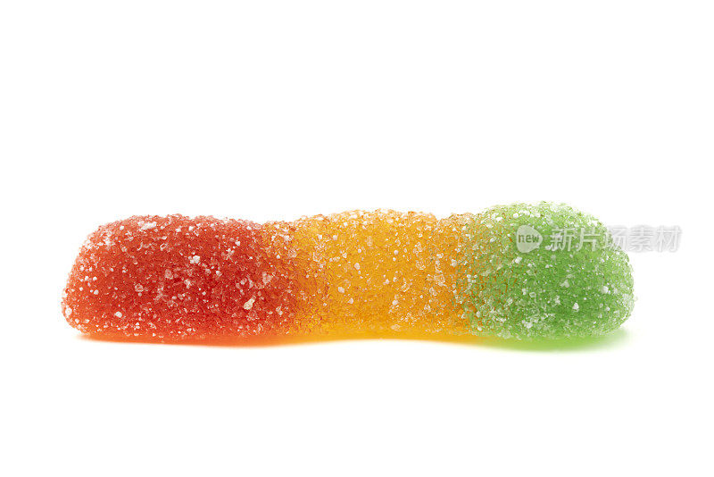 一个完整的红、绿、黄、彩果冻蠕虫糖孤立在白色的背景上