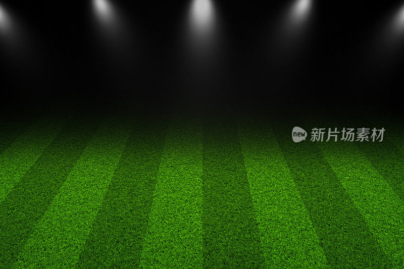 绿色的足球场，明亮的聚光灯