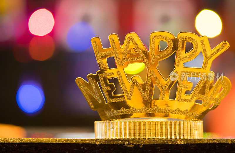 金色快乐新年头带上彩色的散景背景