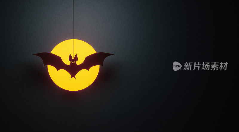万圣节概念-单剪蝙蝠飞过月亮在黑色的背景