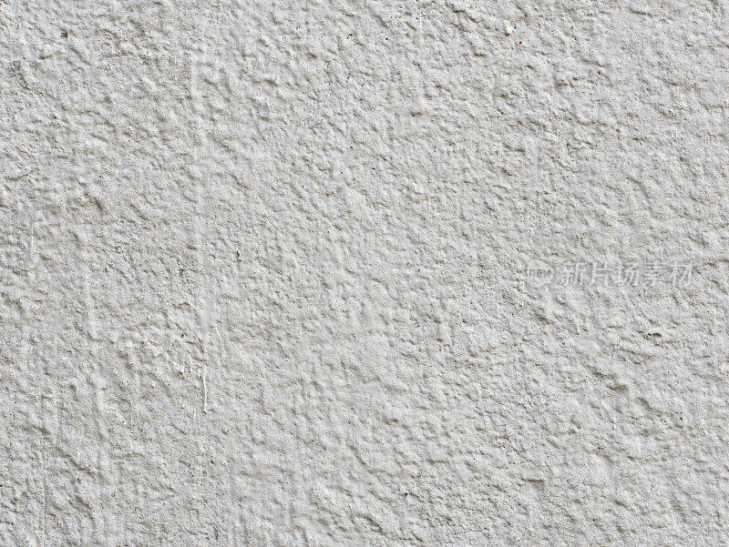 白色的墙壁，纹理不均匀。
