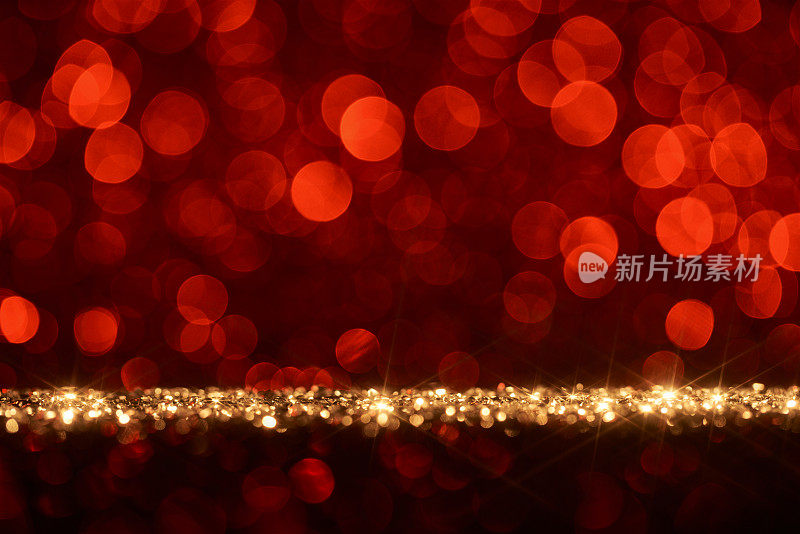 闪亮的红色假日背景-星散焦金色散景