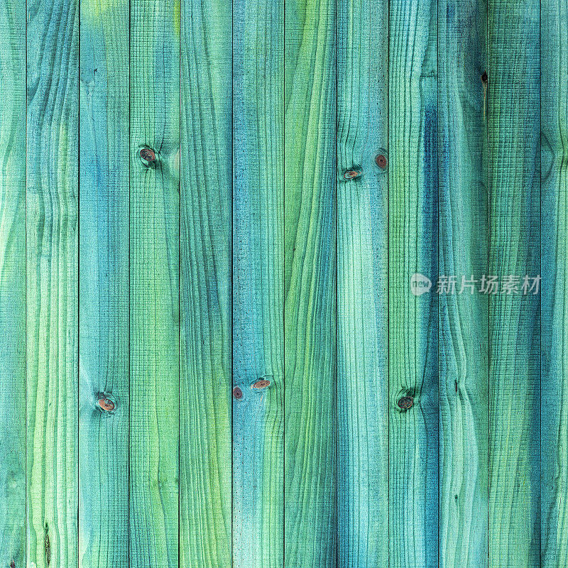 古老的风化抽象绿色，绿松石色镶板木栅栏有很多木纹，结和纹理。