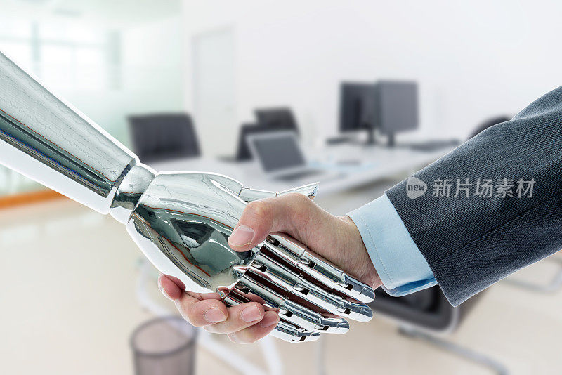 商人和机器人在办公室握手