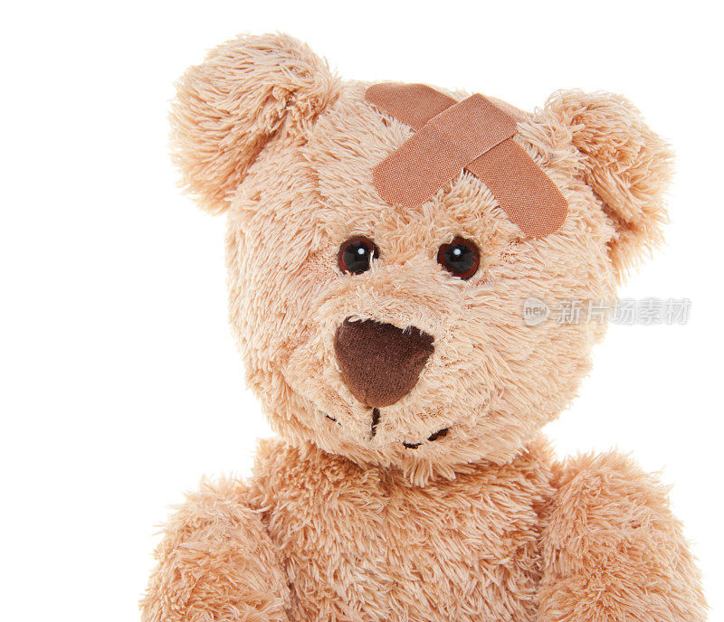 受伤的可爱泰迪熊带着绷带
