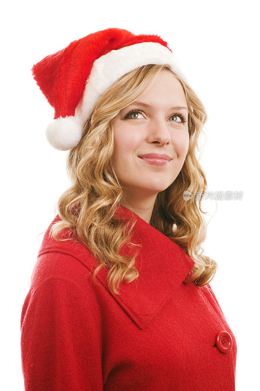 年轻的金发女人戴着圣诞老人帽许下圣诞愿望