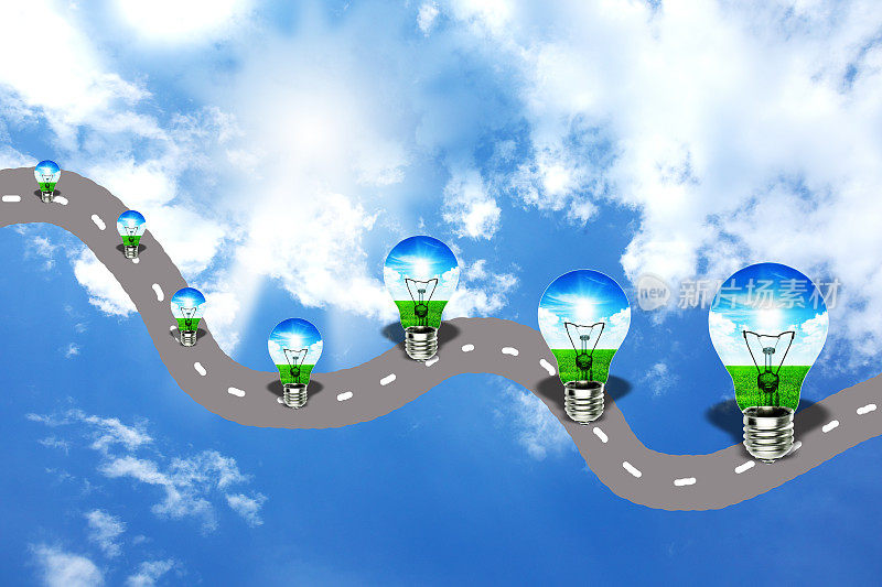 未来的道路和可持续增长的概念与一组灯泡在道路上的天空