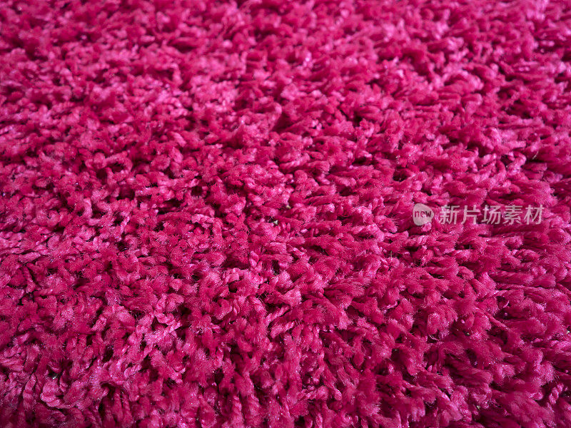 粉红色毛茸茸的地毯的特写