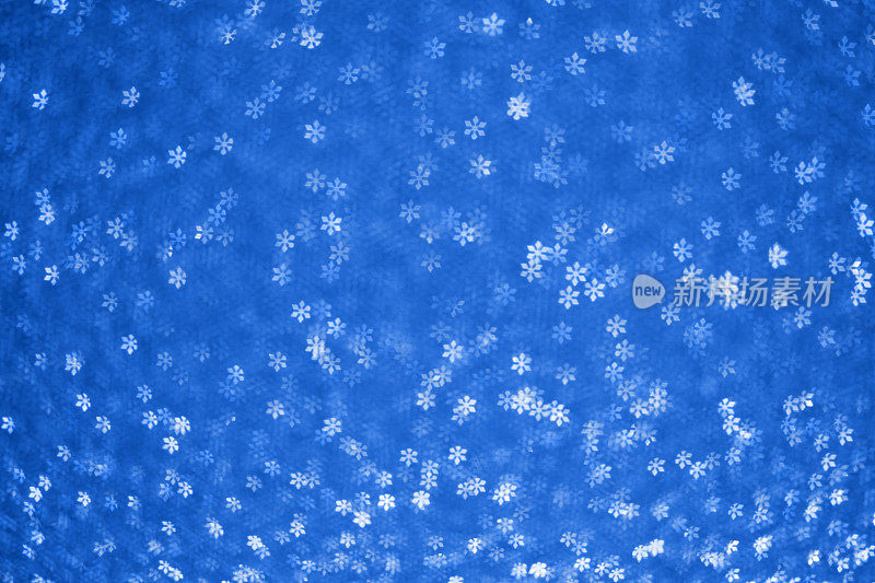圣诞背景-雪花形状的散景(蓝色)