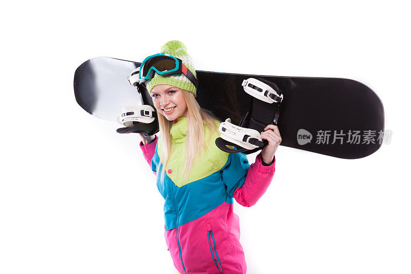 美丽的年轻女子滑雪服和滑雪眼镜持有滑雪板