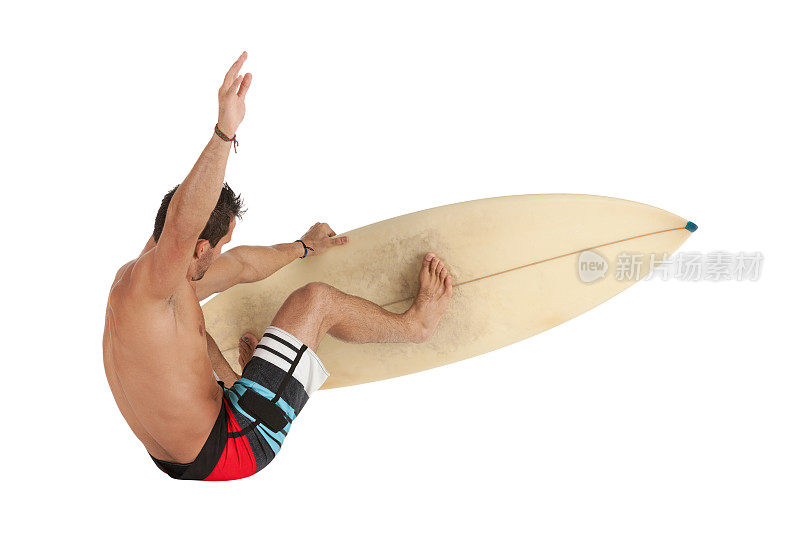 冲浪者用他的冲浪板跳跃