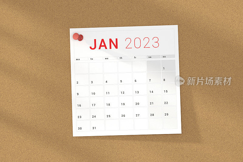 2023年一月日历页钉在软木板。