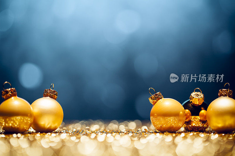 金色圣诞时间-装饰灯散焦蓝色黄金