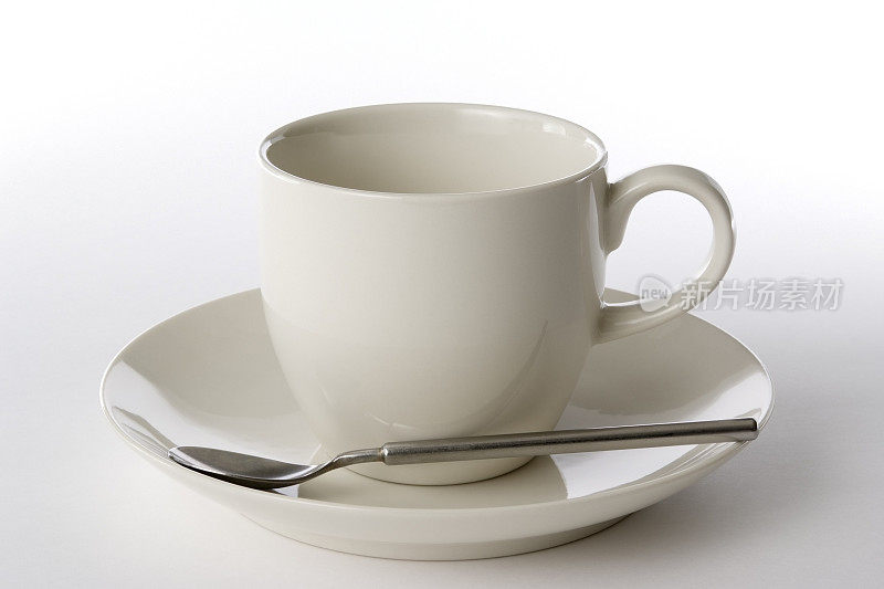 孤立的咖啡杯与勺子在白色的背景