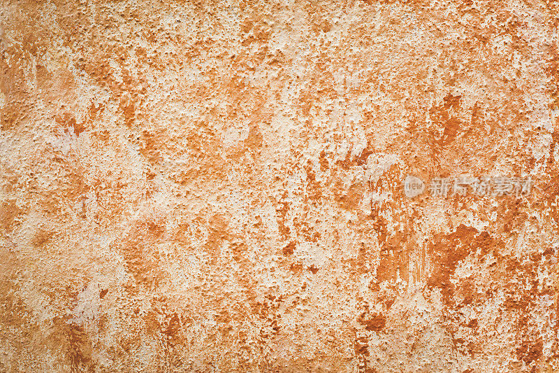 斑驳的粉红橙色墙壁纹理
