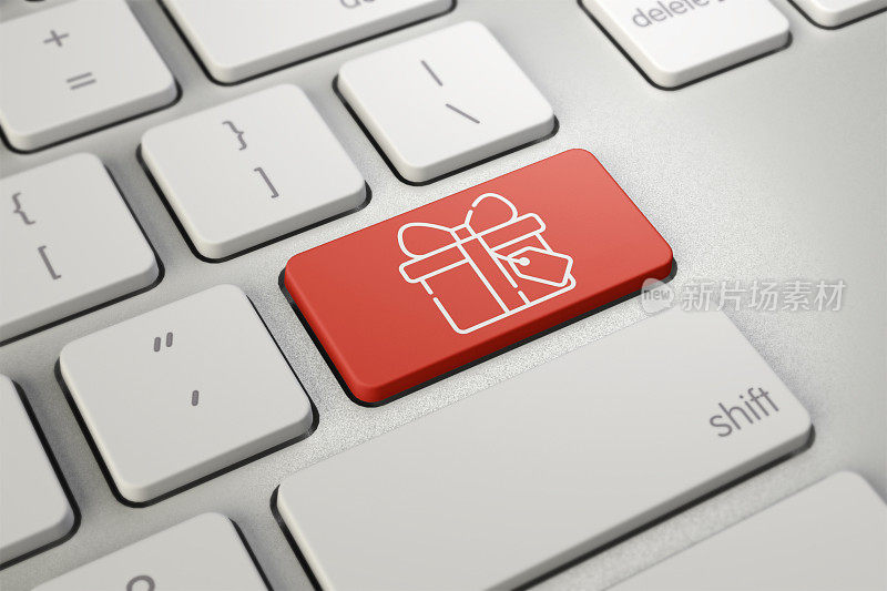 圣诞节的网上购物。键盘与礼物符号键-圣诞网上购物概念。电子商务的概念。电脑、笔记本电脑。网上购买，现在就购买