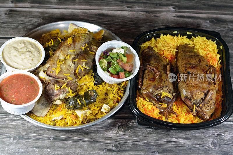 埃及Hamam鸽子，Mahshi填充乳鸽，米饭和羊腿在砂锅中煮得很熟，在烤箱里用巴斯马蒂米饭和葡萄叶填充蔬菜