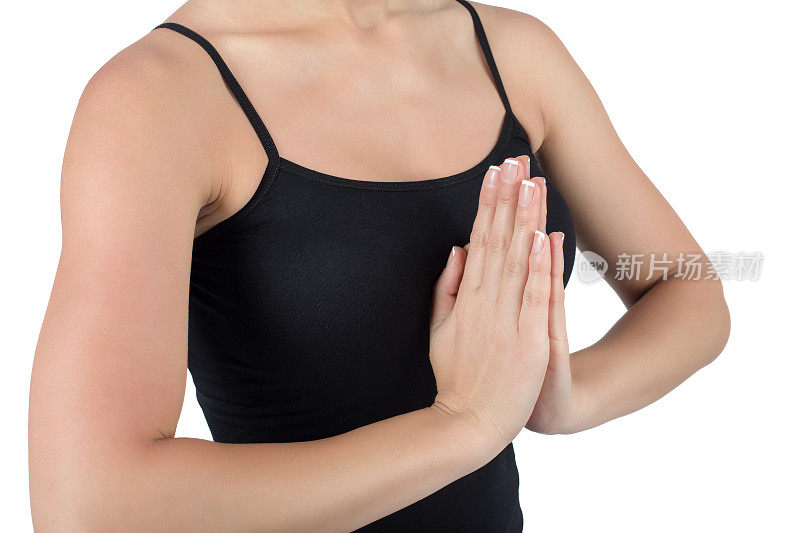 年轻女子练习瑜伽的手的靠近