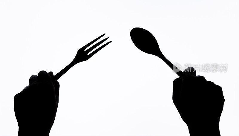 握勺子和叉子的剪影手势