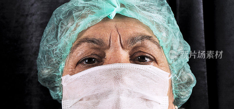 冠状病毒covid-19老年妇女口罩卫生员工