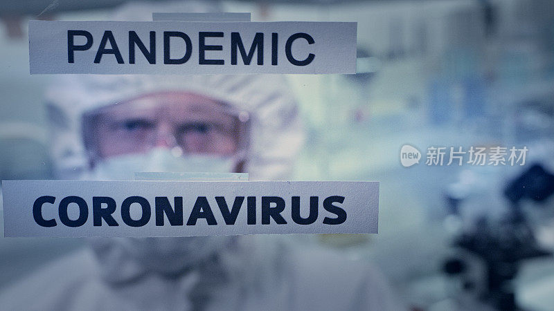 看看单词“Pandemic”和“Coronavirus”。象征性的实验室斗争。带防毒面具的医护人员