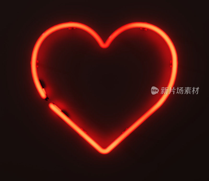 中心发光的3D渲染霓虹灯心脏标志在墙上