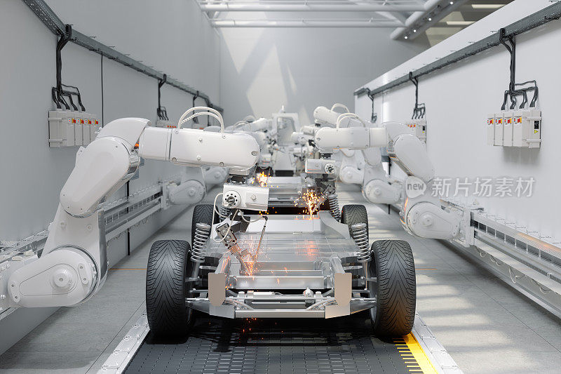 在汽车厂装配汽车的机器人手臂的正面视图