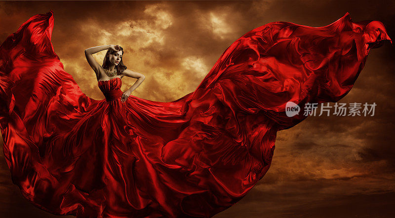 女人红裙飞舞的丝绸面料，时装模特舞风