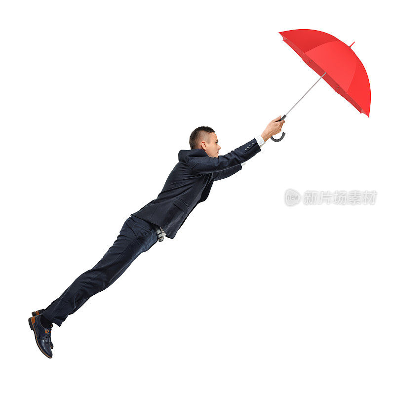 一个商人拿着一把打开的红伞，让他漂浮在空中