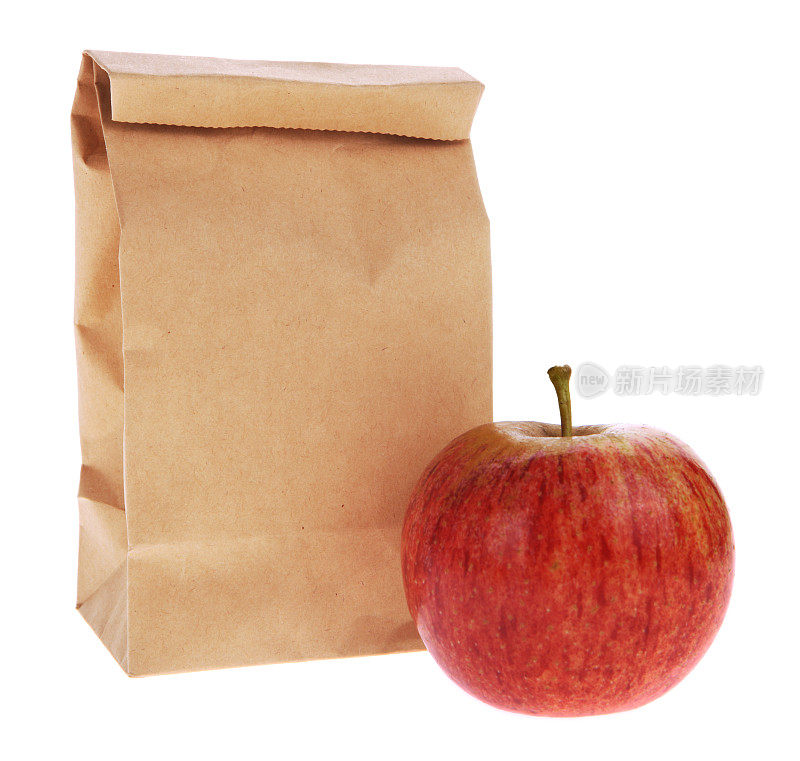 盒装午餐-棕色包与白色苹果隔离