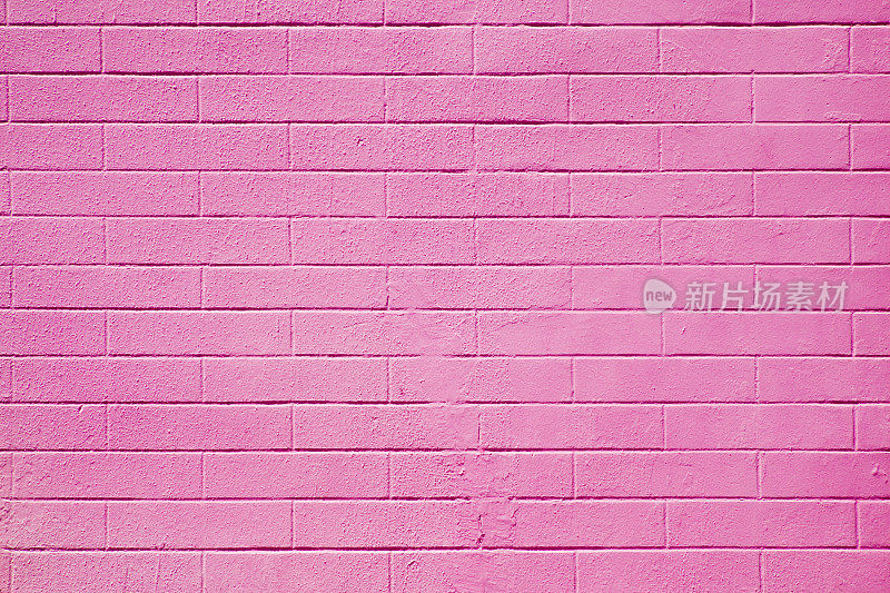 混凝土砖墙漆成粉红色。