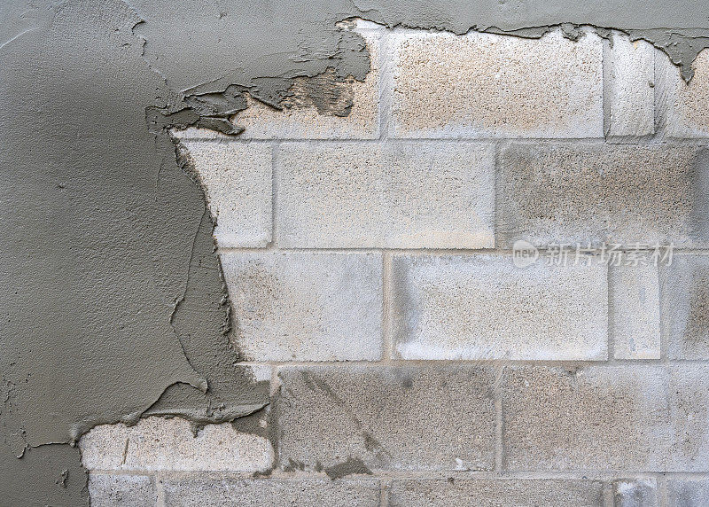 混凝土砌块墙和石膏背景