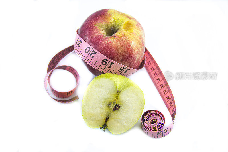 卷尺和青苹果健康饮食概念