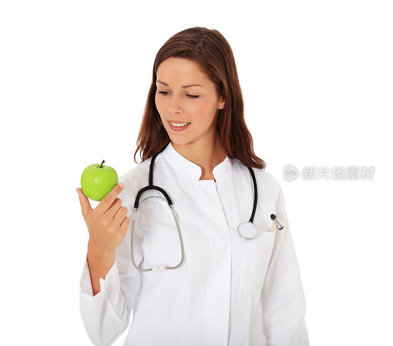 漂亮的医生拿着青苹果