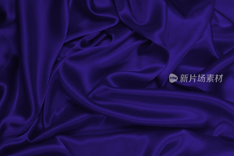 紫色真丝或缎面奢华面料纹理可作为抽象背景。