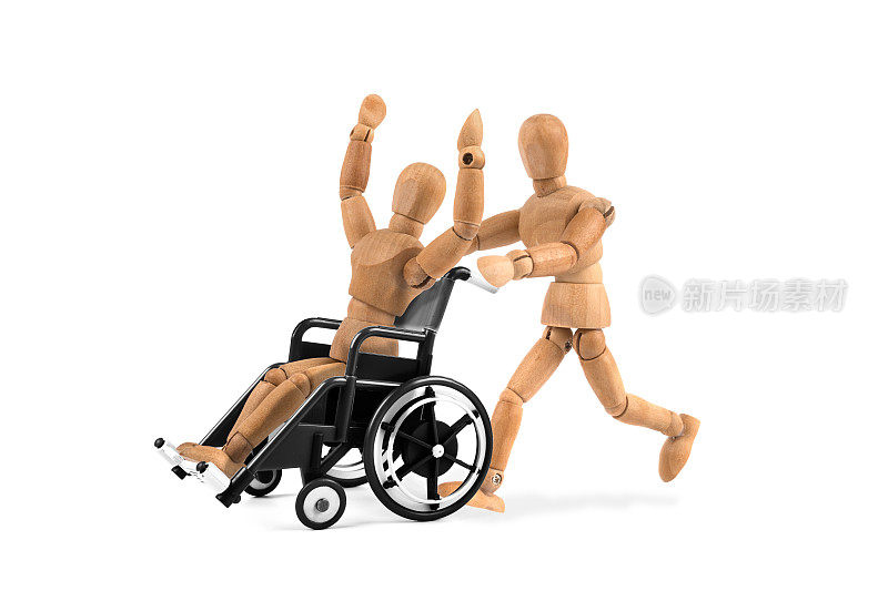 轮椅上的残疾木制假人是快乐的朋友赢?玩得开心吗?