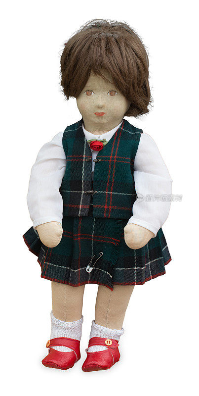 穿着苏格兰服装的古董娃娃